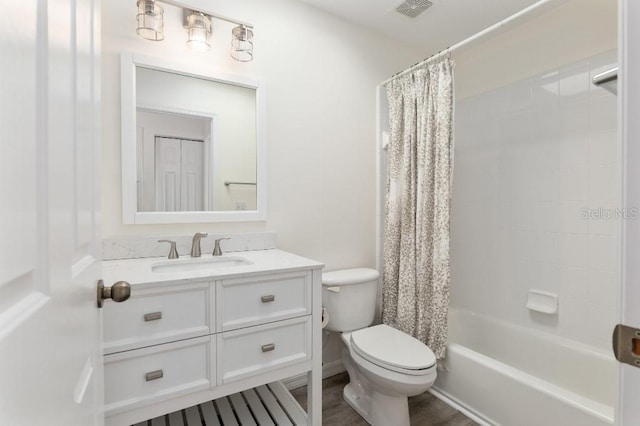 full bathroom with vanity, shower / bath combination with curtain, and toilet