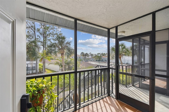 sunroom / solarium with a water view