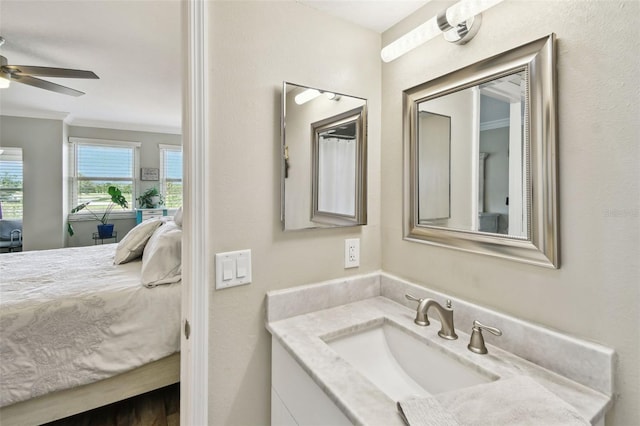 bathroom with vanity, ornamental molding, and ceiling fan