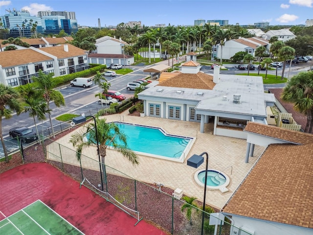 view of pool featuring a community hot tub and a patio area