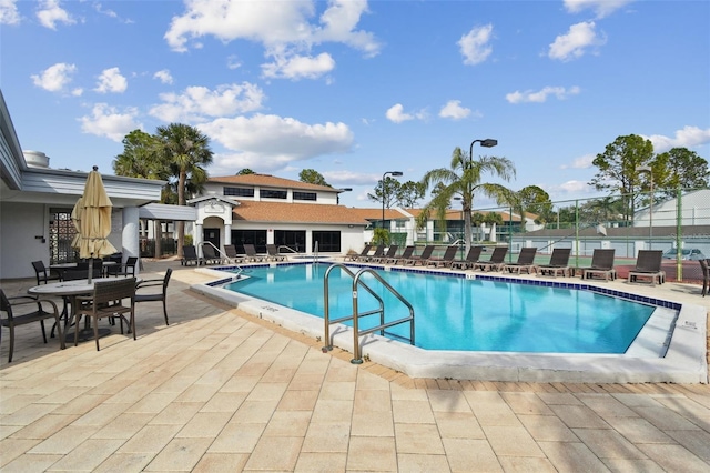 view of swimming pool with a patio area