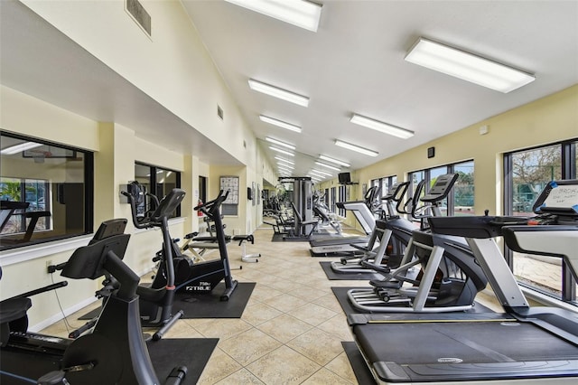 workout area featuring light tile patterned floors