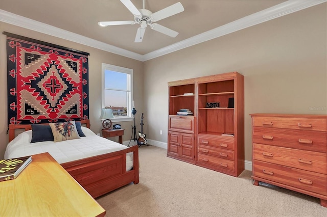 carpeted bedroom featuring ornamental molding and ceiling fan