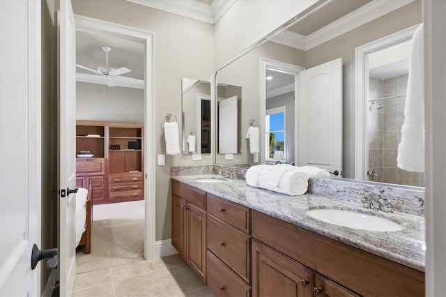 bathroom with crown molding, ceiling fan, vanity, and tile patterned floors