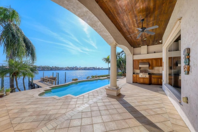 view of swimming pool with a water view, area for grilling, ceiling fan, and a patio area