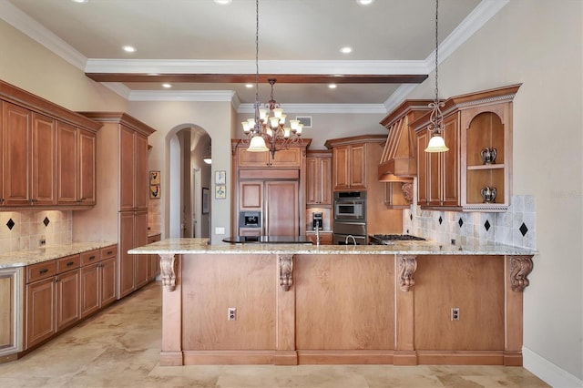 kitchen with light stone counters, decorative light fixtures, a breakfast bar area, and paneled built in refrigerator