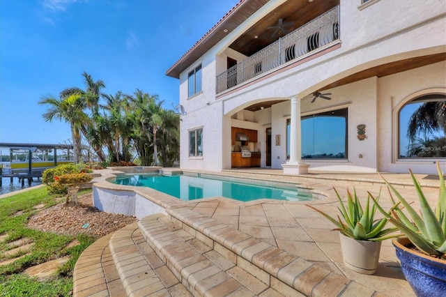 view of pool featuring ceiling fan and a patio area