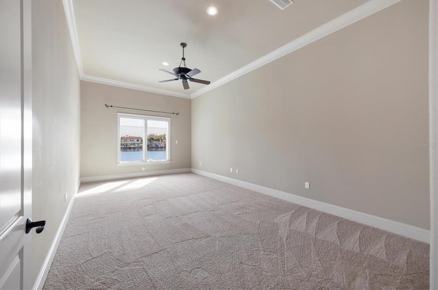 unfurnished room featuring ornamental molding, carpet floors, and ceiling fan