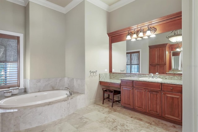 bathroom with crown molding, plenty of natural light, tiled bath, and vanity