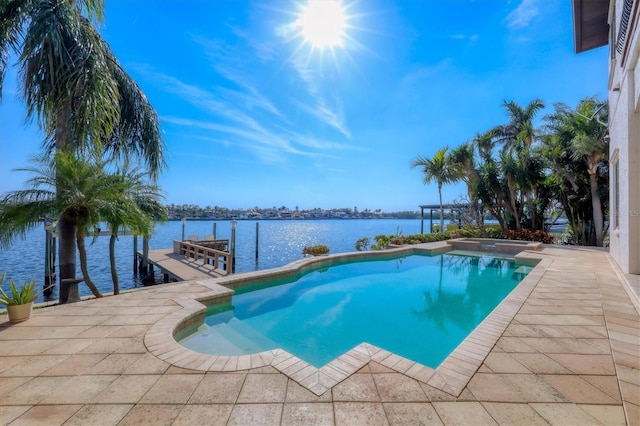 view of pool with a water view, a dock, and a pergola