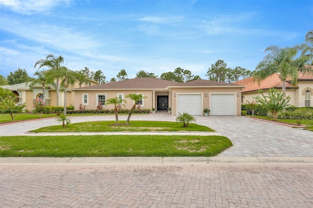 single story home featuring a garage