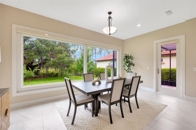 dining area featuring light tile patterned floors