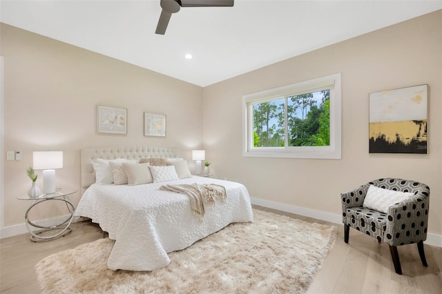 bedroom with ceiling fan and light wood-type flooring