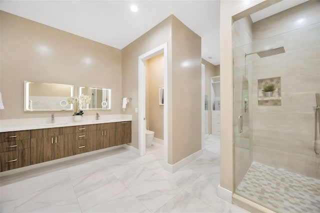 bathroom featuring walk in shower, vanity, and toilet