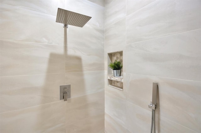 bathroom with tiled shower