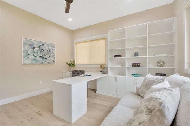 office space with ceiling fan and light hardwood / wood-style floors