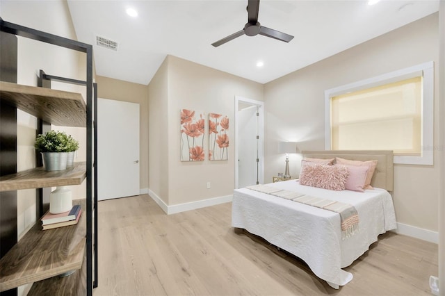 bedroom with light hardwood / wood-style flooring and ceiling fan