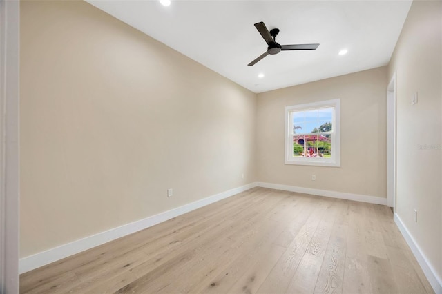 unfurnished room with ceiling fan and light wood-type flooring