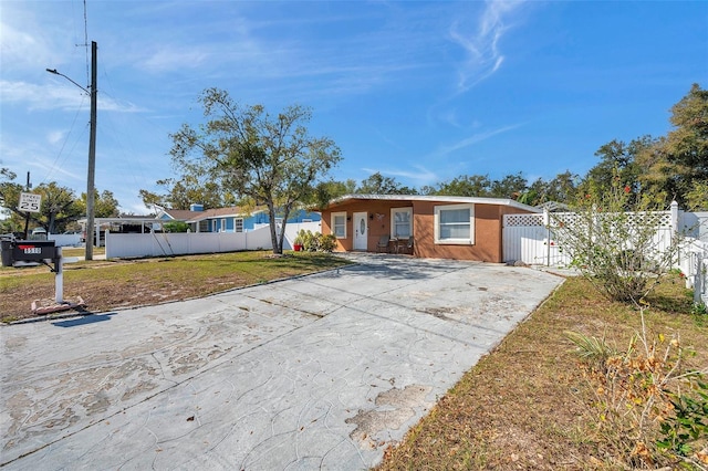 ranch-style home with a front yard