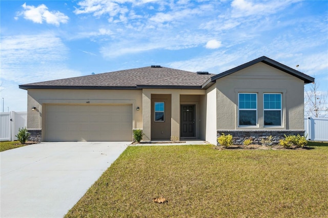 view of front of house featuring a garage and a front yard