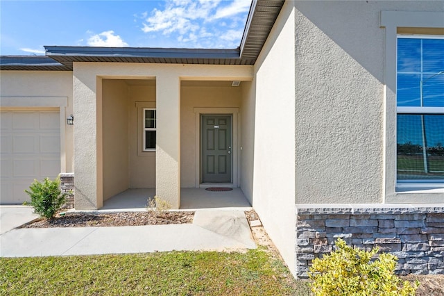 property entrance with a garage