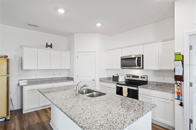 kitchen featuring stainless steel appliances, sink, and white cabinets