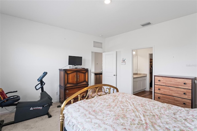 bedroom featuring light colored carpet