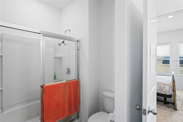 bathroom with walk in shower and toilet