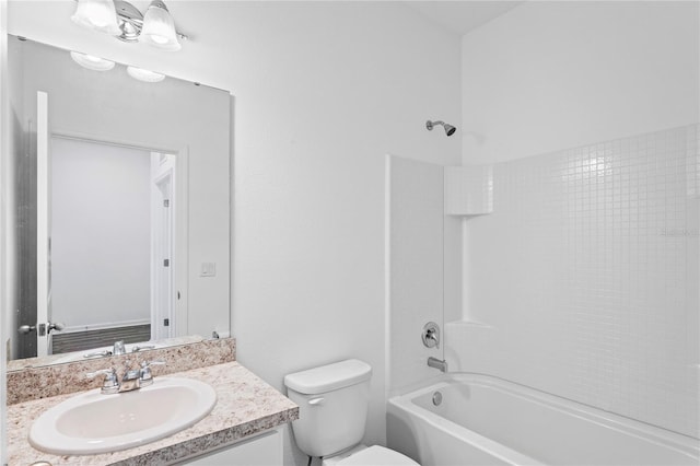 full bathroom featuring shower / bathing tub combination, vanity, and toilet