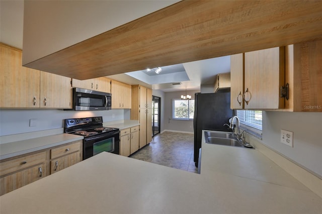 kitchen with black range with electric stovetop, sink, a chandelier, and light brown cabinetry