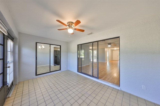 empty room featuring ceiling fan