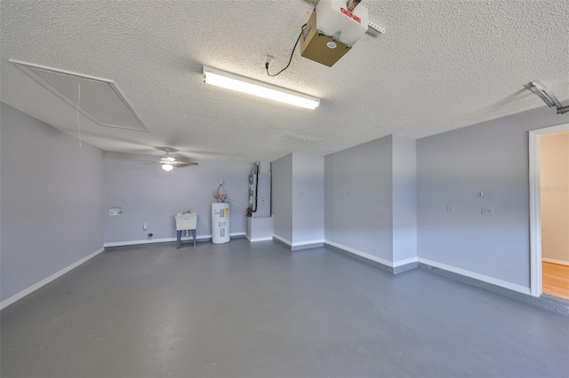 garage featuring sink and electric water heater