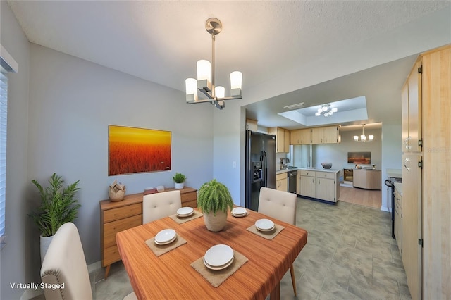 dining space with a chandelier