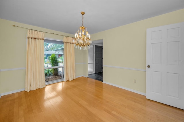 interior space with hardwood / wood-style floors and a notable chandelier