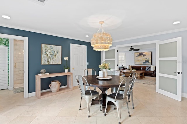 dining room featuring ornamental molding, light tile patterned floors, and a chandelier