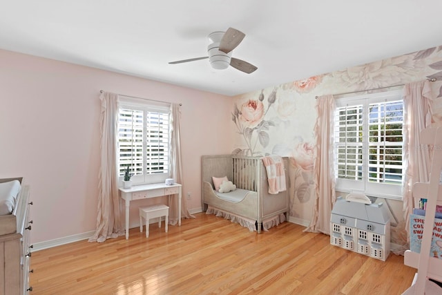 bedroom with ceiling fan and light hardwood / wood-style flooring