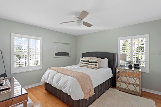 bedroom featuring ceiling fan and light hardwood / wood-style flooring