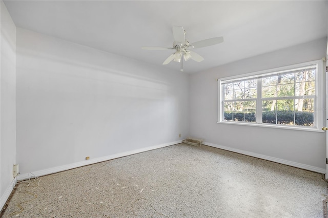 empty room featuring ceiling fan