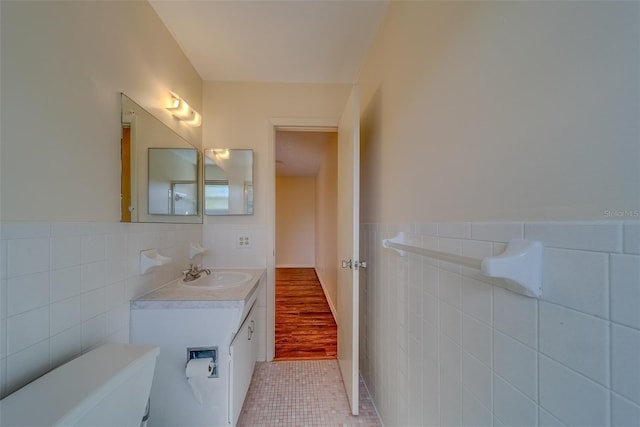 bathroom featuring tile walls, vanity, and tile patterned floors