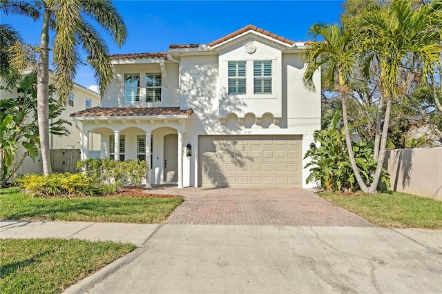 mediterranean / spanish-style home featuring a garage