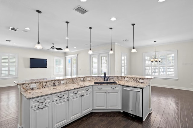 kitchen featuring sink, ornamental molding, white cabinets, a center island with sink, and stainless steel dishwasher