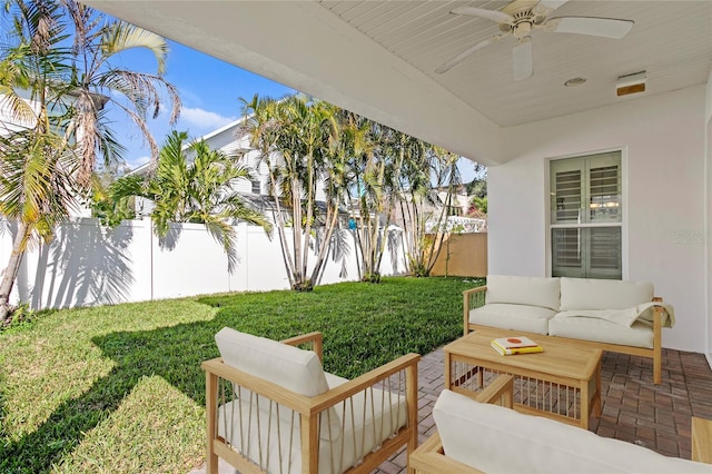 view of patio / terrace with an outdoor living space and ceiling fan