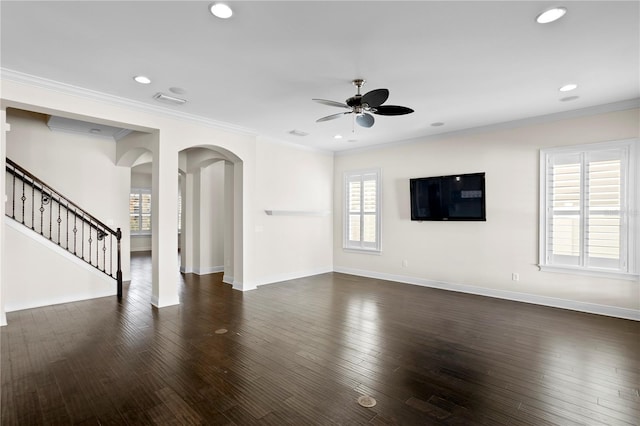 unfurnished living room with dark wood-type flooring, ceiling fan, and ornamental molding