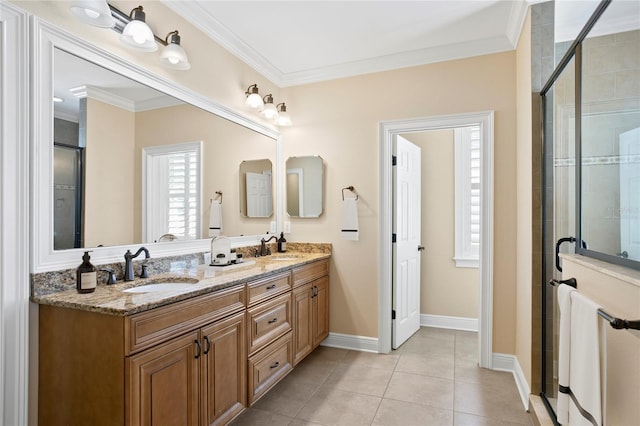 bathroom featuring vanity, crown molding, a shower with shower door, and tile patterned floors