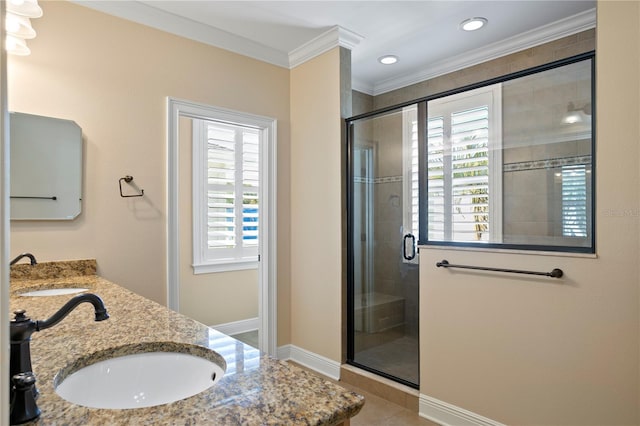 bathroom featuring crown molding, a wealth of natural light, vanity, and a shower with shower door