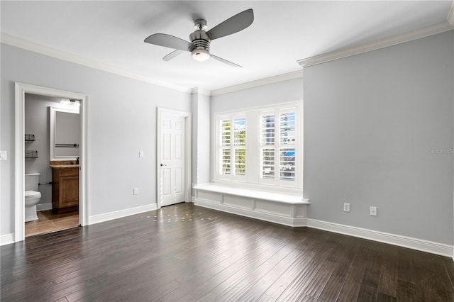 unfurnished bedroom with crown molding, dark hardwood / wood-style floors, ensuite bathroom, and ceiling fan