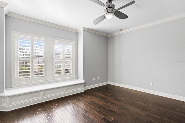 spare room featuring crown molding, dark wood-type flooring, and ceiling fan