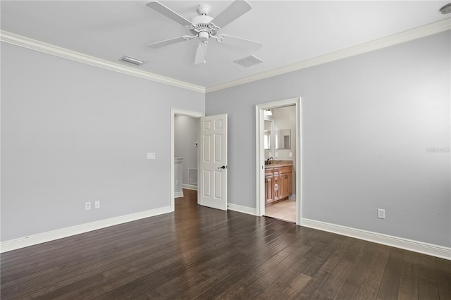 unfurnished bedroom with dark wood-type flooring, ceiling fan, ensuite bathroom, and crown molding