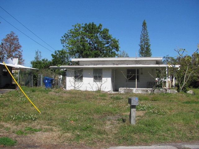 exterior space featuring a carport and a porch