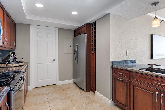 kitchen with light tile patterned flooring, appliances with stainless steel finishes, sink, dark stone countertops, and hanging light fixtures